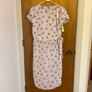 NWT. Cute lightweight dress with side tie and tulip like sleeves. Very summery.